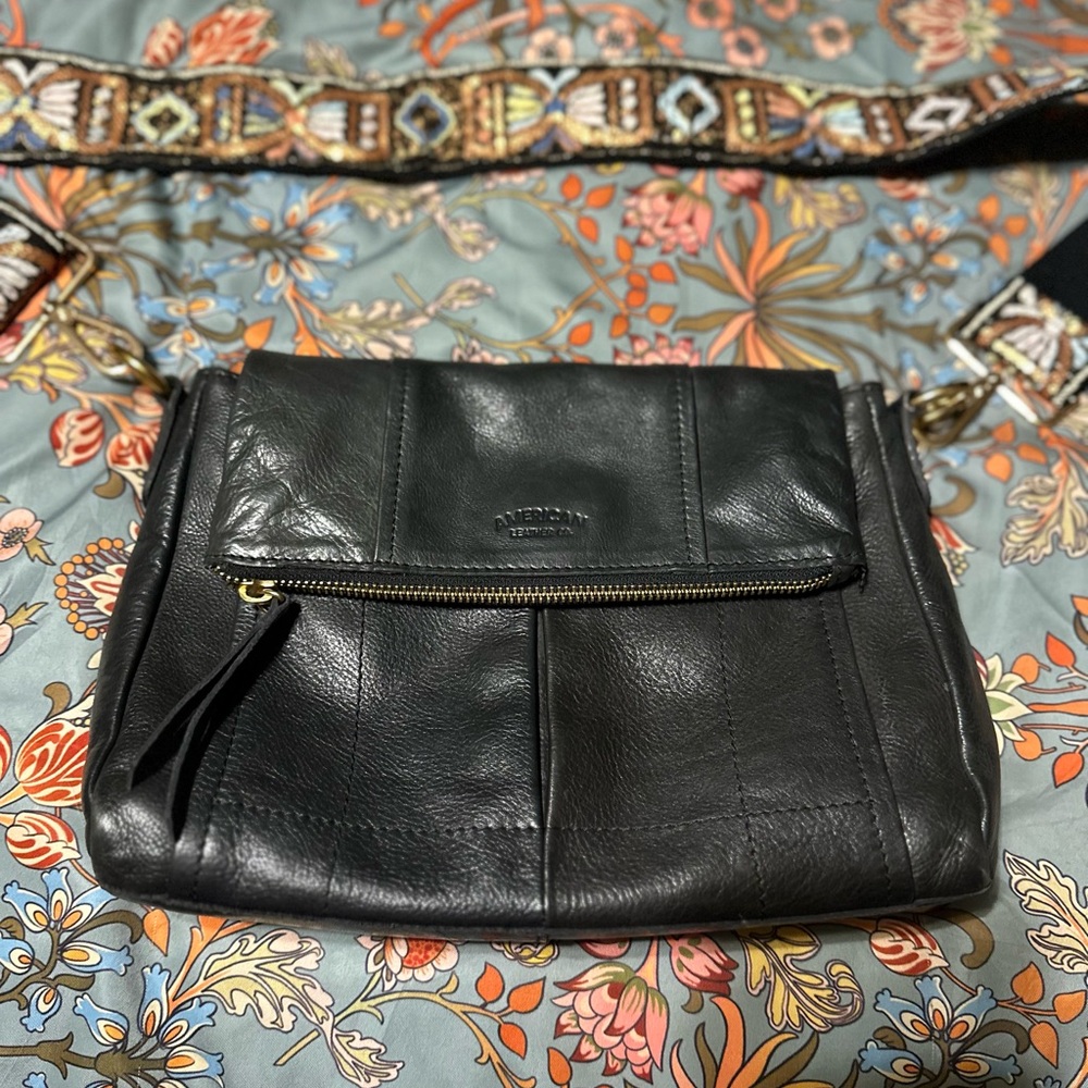 Elegant Black Leather Crossbody Bag with Embroidered Strap